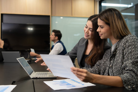 New business people in the conference room are exchanging information with each other along with rehearsing important information before presenting work and new projects to the management teamの写真素材