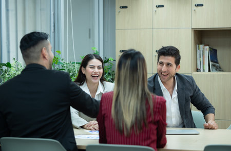 A group of young entrepreneurs. Meeting to exchange opinions and review information to prepare for...