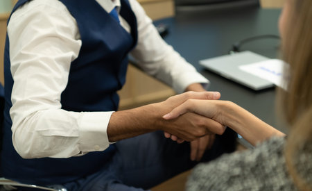 New business people in the conference room are exchanging information with each other along with...