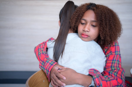 Portrait of Teenage embrace each other to encourage each other.の写真素材