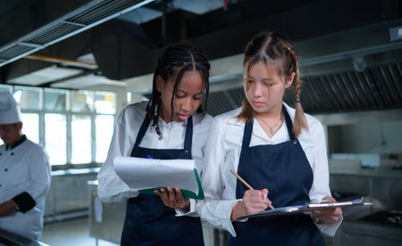 Young chef, University professor is passing on the knowledge of cooking to studentsの写真素材