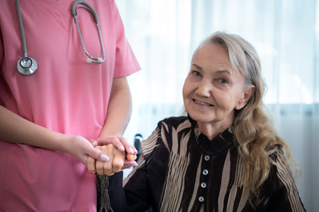 Caregiver for an elderly woman Weekly check-ups at the patient's residence. Ready to give medical advice and talk about various stories, exchange each other happily.の写真素材