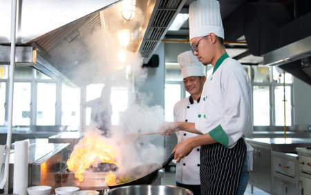 Chefs that specialize in cooking will be meticulous with every cooking process. Even minor details will not be overlooked. As with stir-fry, high heat will be used until a flaming flame appearsの写真素材