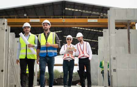 Architects a visit to the construction site. Ready to talk the progress of construction projects in...