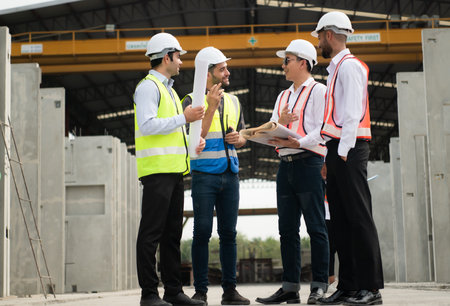 Architects a visit to the construction site. Ready to talk the progress of construction projects in...
