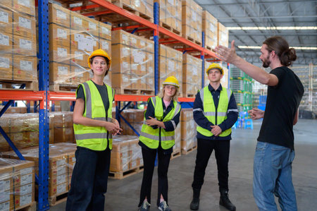 Portrait of worker in an auto parts warehouse, Encourage each other after completing tasks and finishing the day.の写真素材