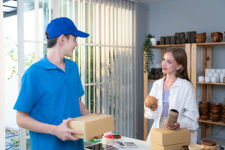 The delivery man brings the goods that the customer purchased and delivers them to the customer's...