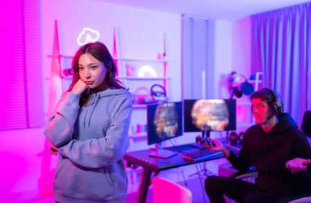 The mood of young ladies who are unsatisfied with their male friends who spend more time playing video games.の写真素材