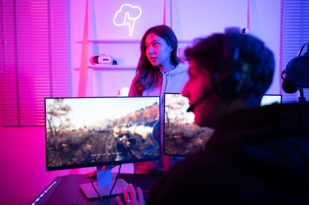 The mood of people waiting to play games when there is only one computer. When the game is over, it's time to switch players.の写真素材