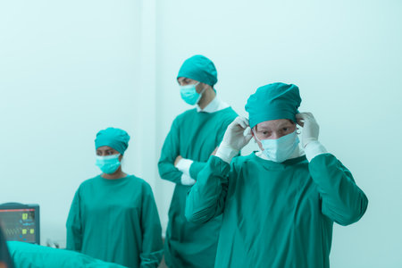 Portrait of professor of medicine in cardiology and a team of doctors in the operating room undergoing heart transplant surgeryの写真素材