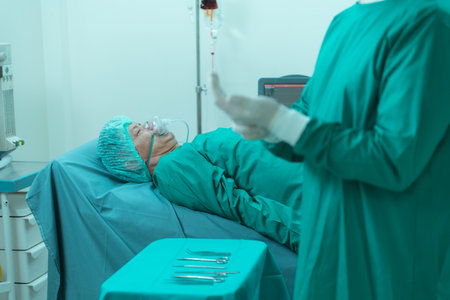 Patients who have undergone heart surgery being under anesthesia when the Anesthesiologist puts anesthesia on him before the operation.の写真素材