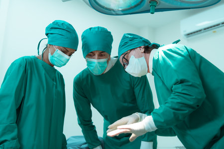 Medical lecturer in cardiology and medical team in the heart transplantation room A knife is being used for surgery on a patient.の写真素材
