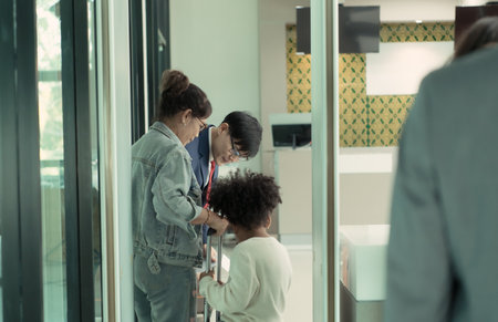 Airline ground staff help passengers check their tickets and passports for travel.の写真素材