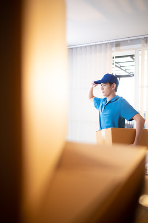 The delivery man brings the goods that the customer purchased and delivers them to the customer's home.の写真素材