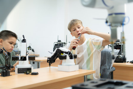 Children using the hand robot technology, Students are studying technology, which is one of the STEM courses.の写真素材