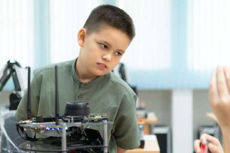 Children using the hand robot technology, Students are studying technology, which is one of the STEM...