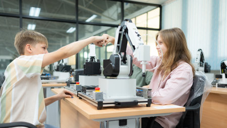 Children using the hand robot technology and having fun Learning, Students are studying technology, which is one of the STEM courses.の写真素材