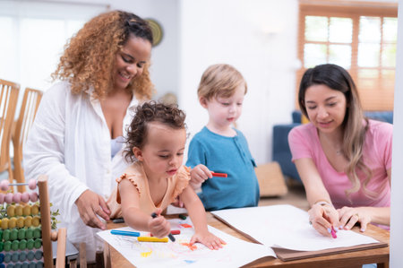 A little child's imagination is represented through colored pencil drawings, with the mother attentively supervising in the living room of the house.の写真素材