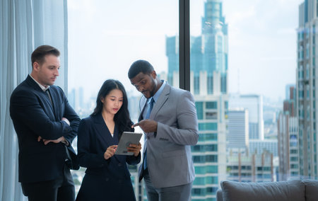 When a group of new businessmen get good news about projects that customers consider accepting proposals. They were overjoyed and delighted with such good news as they sit and rested in the officeの写真素材