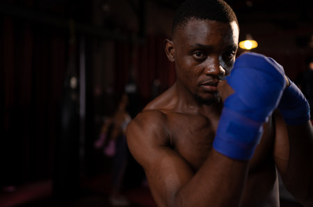 Portrait of foreign boxers vs Muay Thai, Is a Thai martial art of using weapons from the body such as fists, feet, knees, elbows.の写真素材