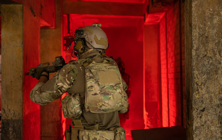 Soldier in anti-terrorist warfare in a dark building, Anti-terrorist operation training on the...