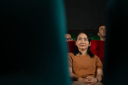 When watching scary ghost movies in theaters, moviegoers appear terrified.