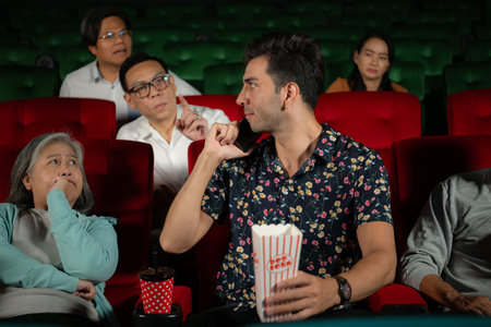 Movie etiquette, Do not talk on the phone while in the cinema, Group recreation and entertainment concept.の写真素材