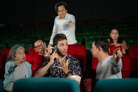 Movie etiquette, Do not talk on the phone while in the cinema, Group recreation and entertainment concept.の写真素材