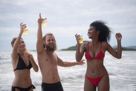 Group of friends having fun on the beach. Young women having fun on the beach.