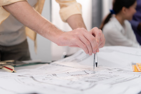 Group of architect and designer is designing a green home building that takes advantage of natural...