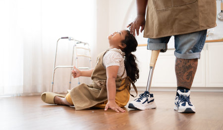 A plus size family with a father wearing a prosthetic leg, The daughter had fun playing with her...