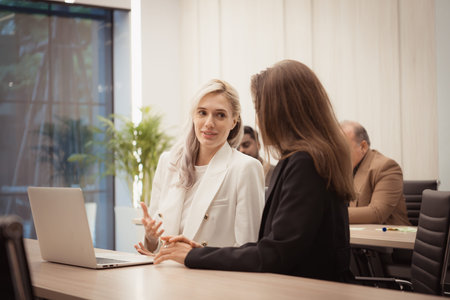 Both of young businesswomen working on a laptop in the office. Business concept