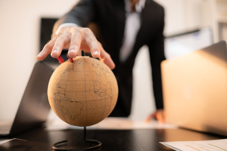 International business concept, businessman and globe modelの写真素材