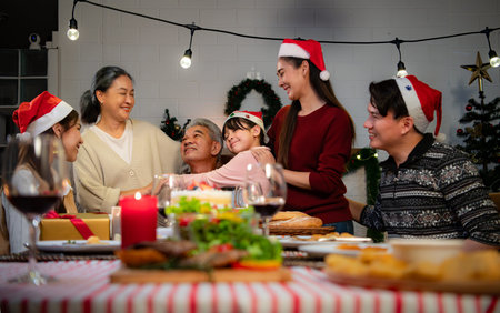 Happy asian family celebrating Christmas and New Year together at home.の写真素材