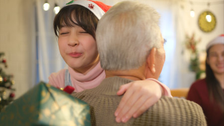 Happy asian family celebrating Christmas and New Year together at home.の写真素材