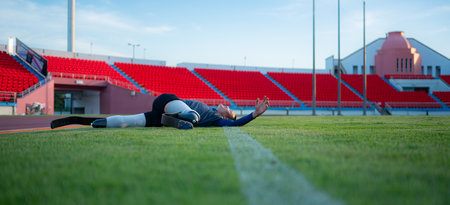 Athletes with disabilities take a break at the stadium between training sessions.の写真素材
