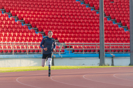 Athletes with disabilities who utilize running blades for short distances. Run down the running track.の写真素材