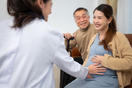 Father and daughter pregnant woman visit gynecologist doctor at medical clinic for pregnancy...