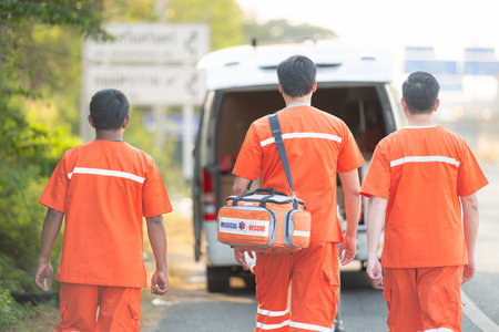 Portrait of paramedic team  is assisting an injured man in an emergency situation on the road.の写真素材