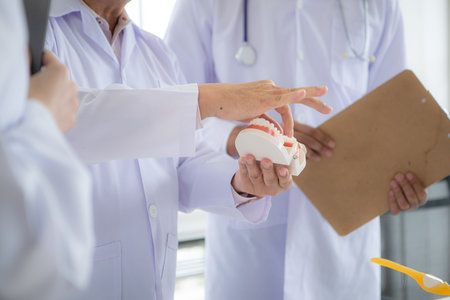 A medical professor is lecturing on a case study related to oral and dental treatment to medical...
