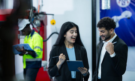 Portrait of businessperson of factory industry inspection and testing of robots arm for use in...