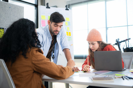 Multiethnic young business people working together in modern office, Collaborate to designing an...