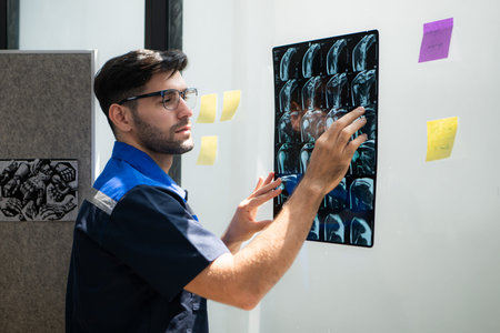 Engineers, doctors and physical therapists brainstorm ideas to design a robot with arm and hand...