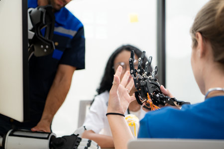 Engineers, doctors and physical therapists brainstorm ideas to design a robot with arm and hand organs, To be utilized for additional testing on patients.の写真素材