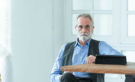 Portrait of professional businessmen working on tablet in a home office