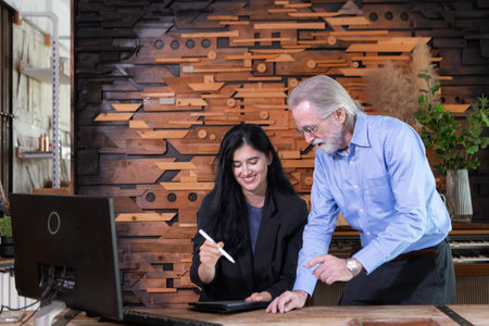A businessmen and businesswomen working on computer in a modern office room