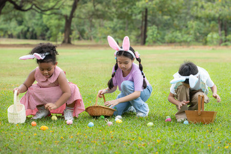 Children enjoying outdoor activities in the park including a run to collect beautiful Easter eggs.