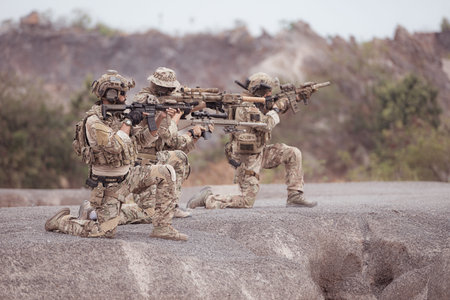 Soldiers in camouflage military uniforms carrying weapons, Reconnaissance missions in rugged...