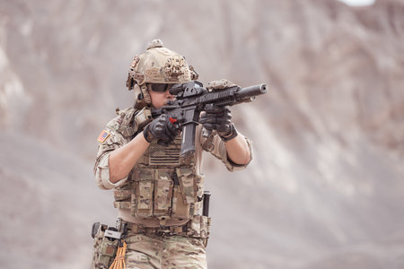 Soldiers in camouflage military uniforms carrying weapons, Reconnaissance missions in rugged...