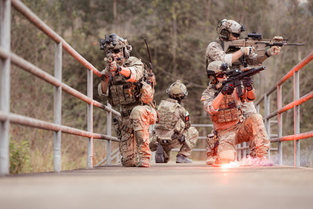 Soldiers in camouflage military uniforms carrying weapons, Reconnaissance missions in the tropical...